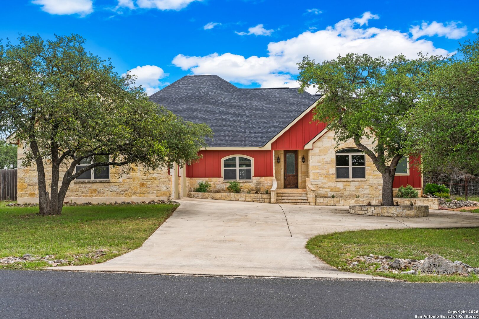 130 Rhum Road Kerrville, TX 78028 - Photo 30 of 31 a front view of a house with a yard and garage