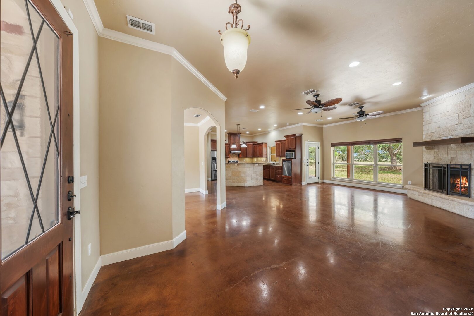130 Rhum Road Kerrville, TX 78028 - Photo 3 of 31 a view of a living room and kitchen with furniture wooden floor and windows