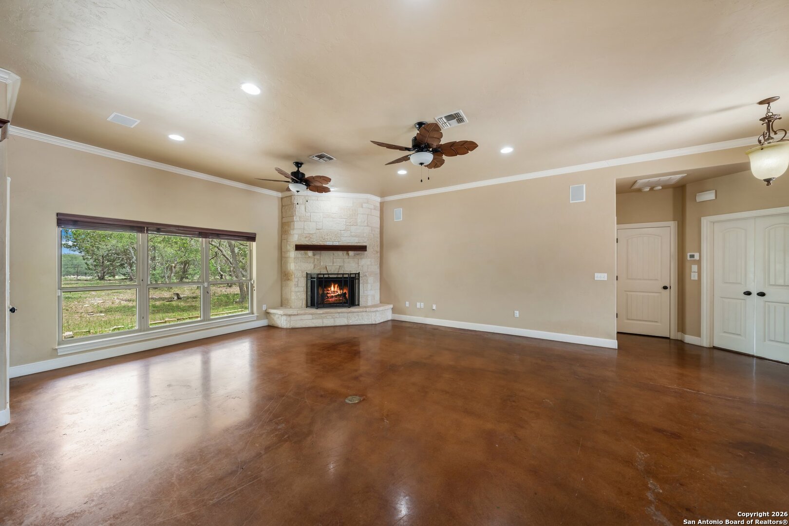 130 Rhum Road Kerrville, TX 78028 - Photo 4 of 31 a view of empty room with wooden floor and fan