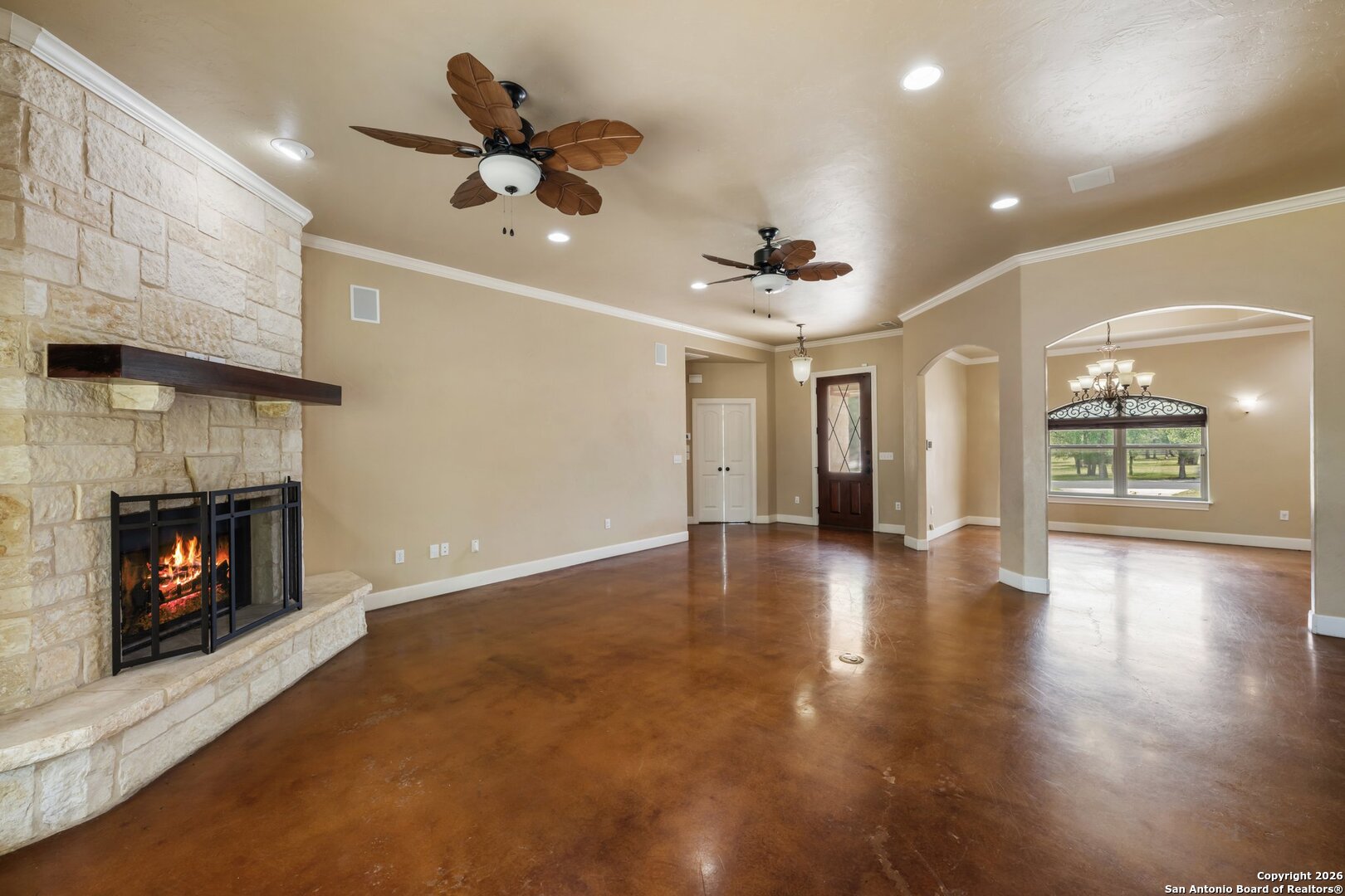 130 Rhum Road Kerrville, TX 78028 - Photo 5 of 31 a view of an empty room with wooden floor fireplace and a window