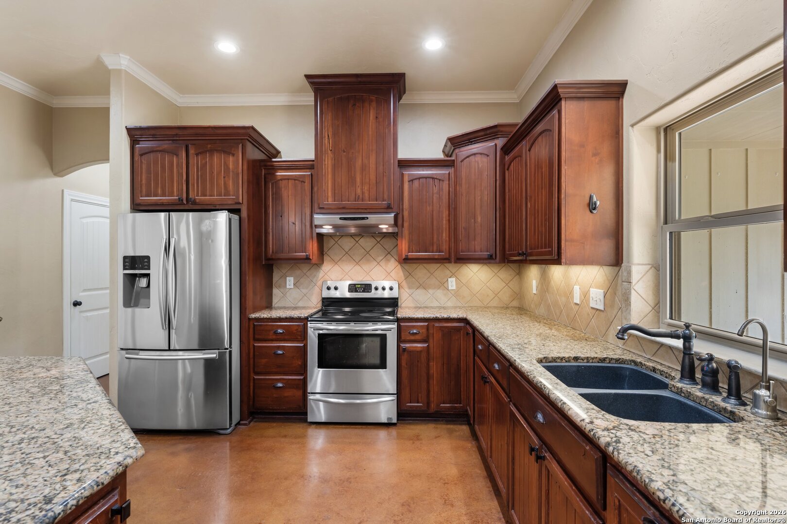 130 Rhum Road Kerrville, TX 78028 - Photo 7 of 31 a kitchen with stainless steel appliances granite countertop a sink stove and refrigerator