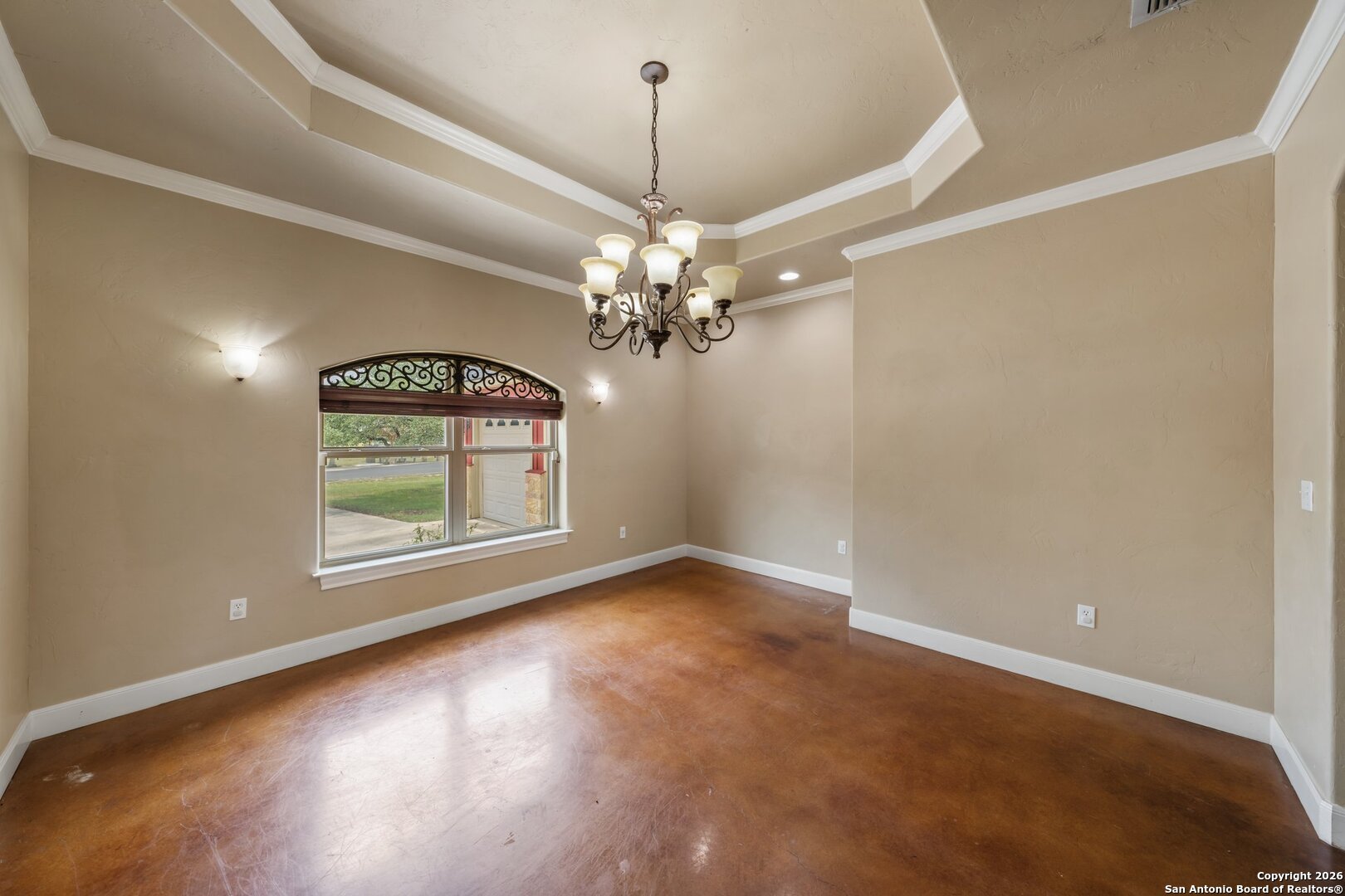 130 Rhum Road Kerrville, TX 78028 - Photo 8 of 31 an empty room with windows and chandelier