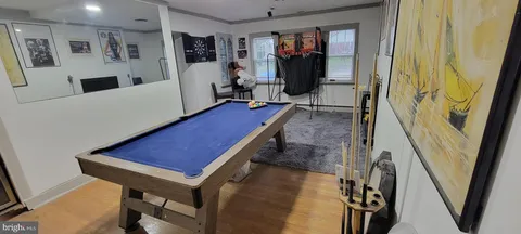 a room with furniture and a wooden floor