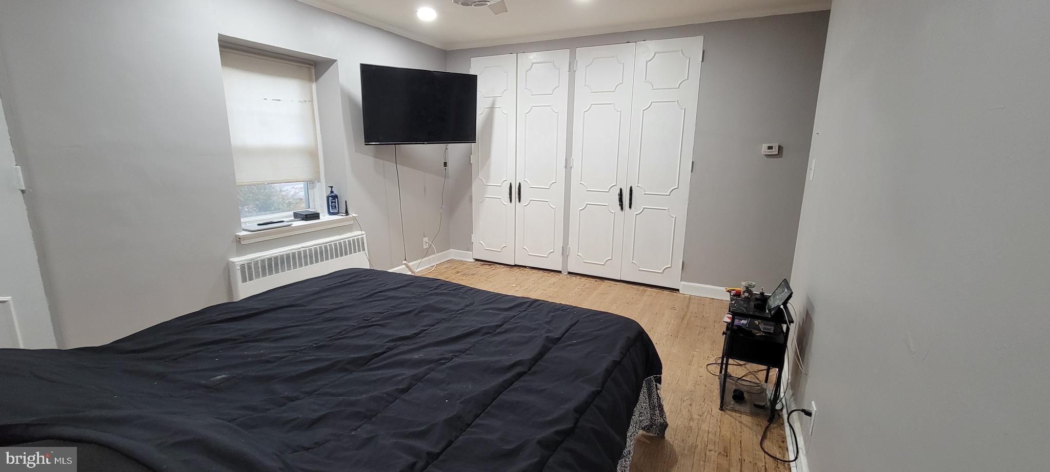 7500 Manchester Road Elkins Park, PA 19027 - Photo 18 of 23 a bedroom with a bed and a flat screen tv