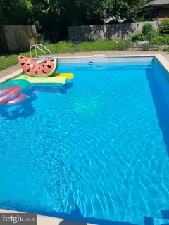 a view of swimming pool with lounge chair