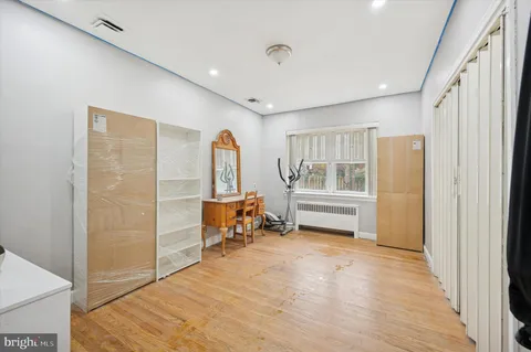 a bedroom with furniture and window