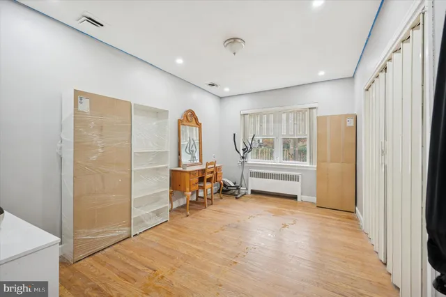 a bedroom with furniture and window