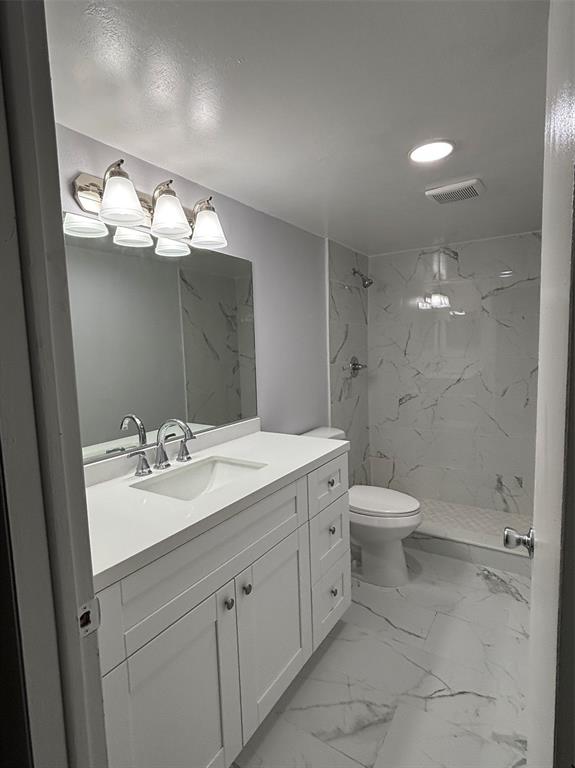 4152 Inverrary Drive, Unit 101 Lauderhill, FL 33319 - Photo 7 of 11 a bathroom with a toilet sink and mirror