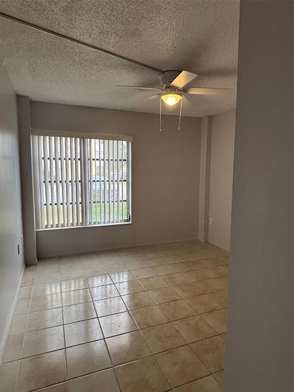 4152 Inverrary Drive, Unit 101 Lauderhill, FL 33319 - Photo 9 of 11 a view of an empty room with a window