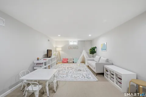 a living room with furniture and a table