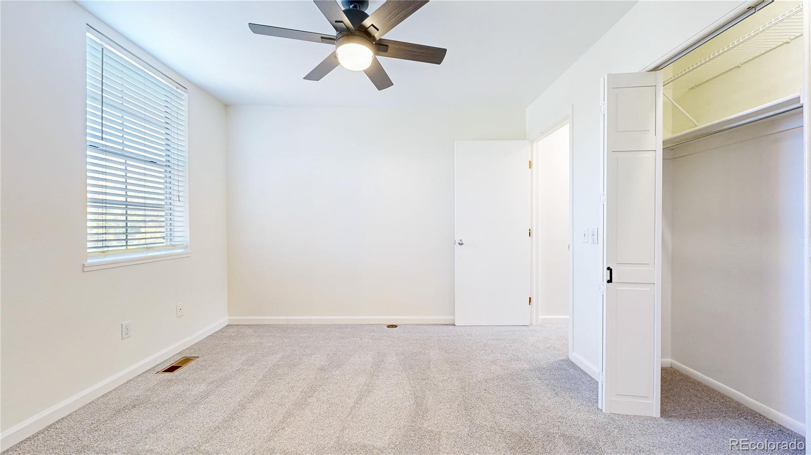 1300 Garfield Street, Unit 1A Denver, CO 80206 - Photo 12 of 33 a view of an empty room with a window
