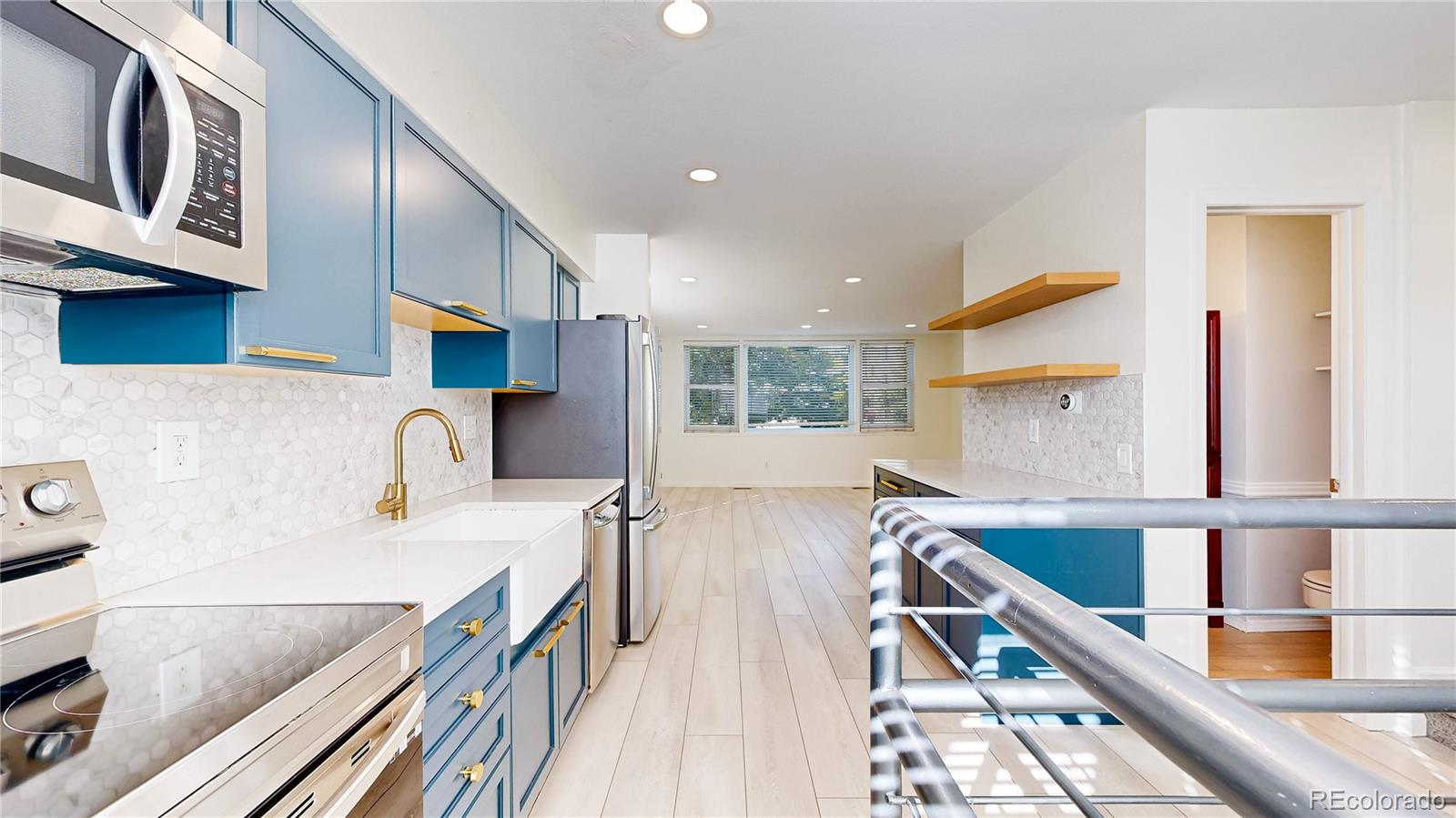 1300 Garfield Street, Unit 1A Denver, CO 80206 - Photo 2 of 33 a kitchen with stainless steel appliances granite countertop a sink a stove and a wooden floors
