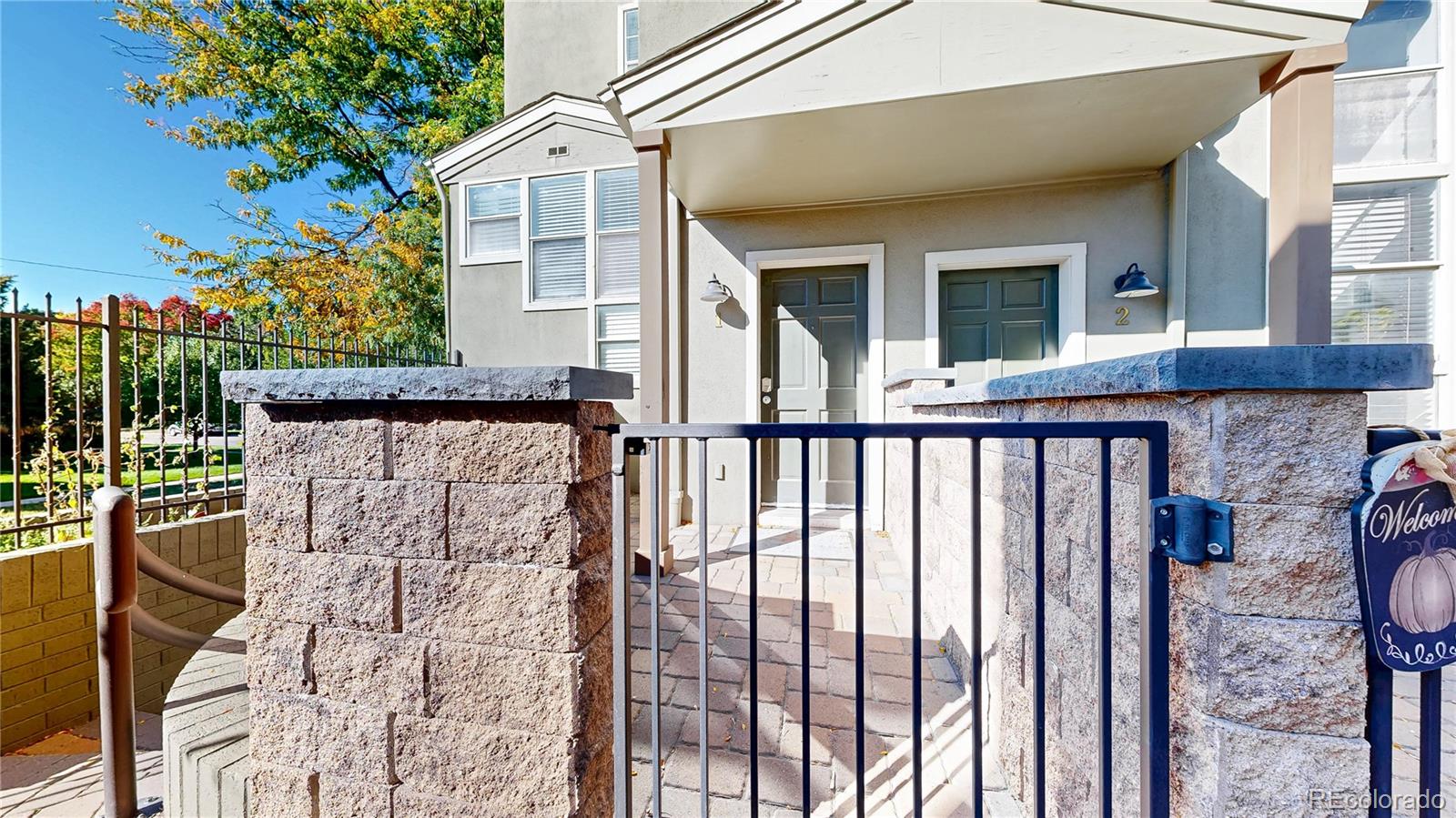 1300 Garfield Street, Unit 1A Denver, CO 80206 - Photo 25 of 33 a view of a brick house with a large windows