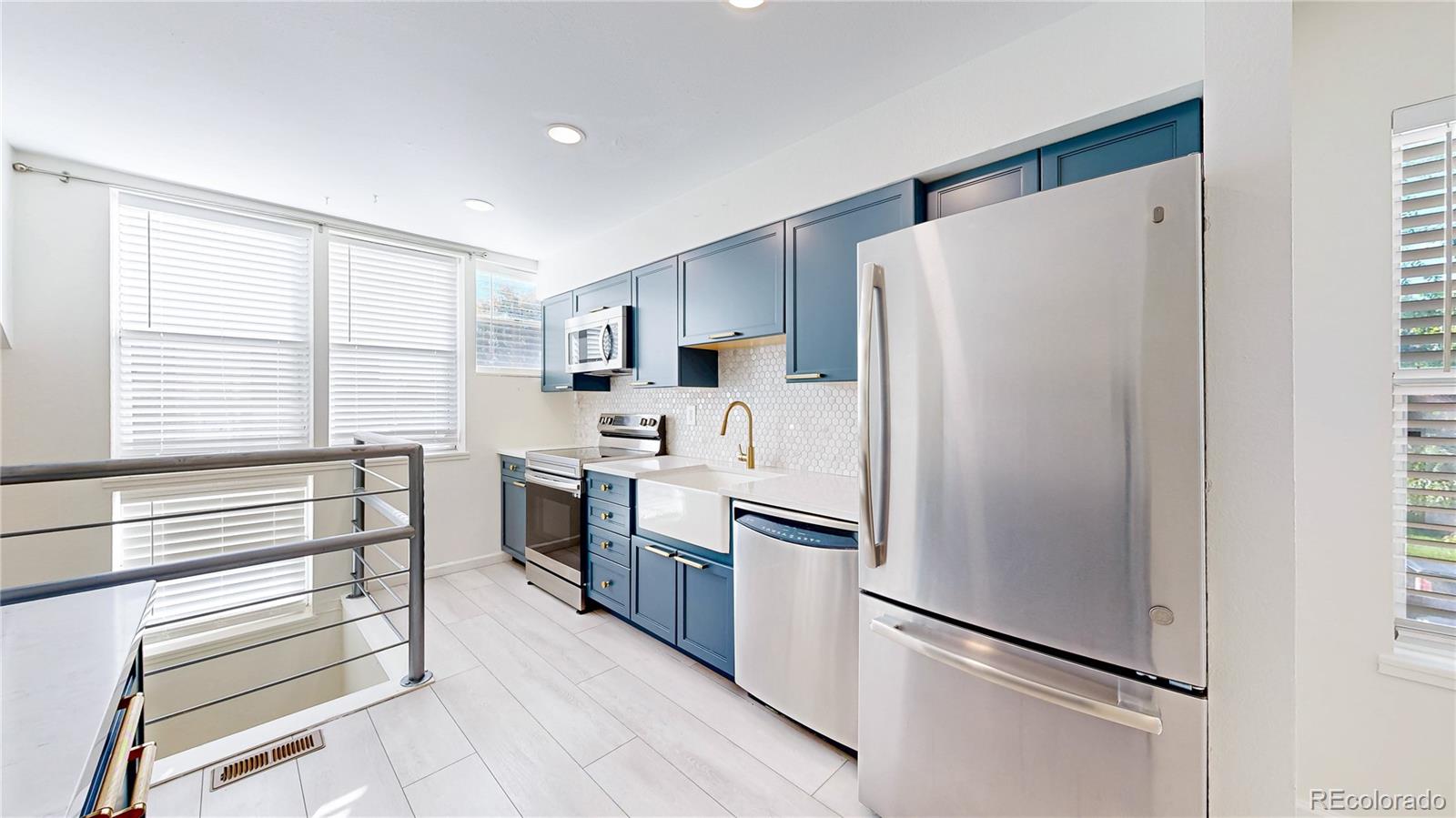 1300 Garfield Street, Unit 1A Denver, CO 80206 - Photo 4 of 33 a kitchen with a refrigerator and a sink