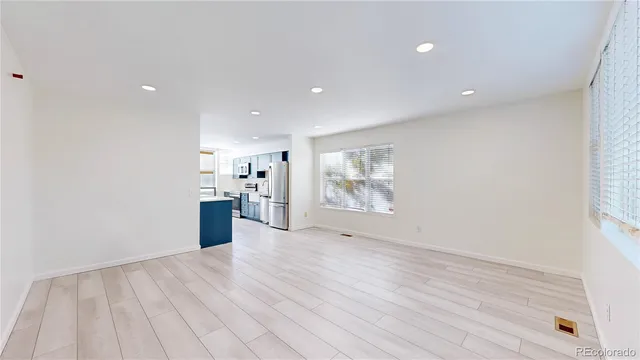 a view of a kitchen with a sink and a window