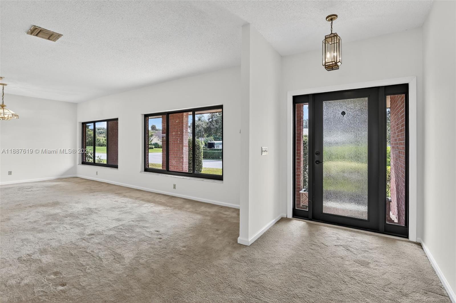 100 129th Avenue Plantation, FL 33325 - Photo 11 of 60 an empty room with windows and closet