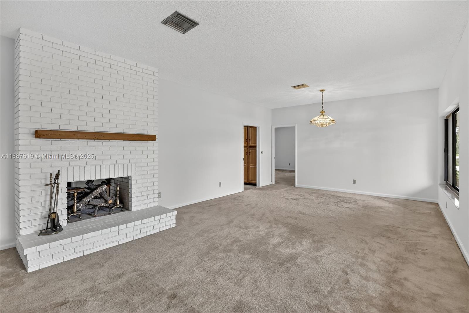 100 129th Avenue Plantation, FL 33325 - Photo 12 of 60 a view of an empty room and fire place