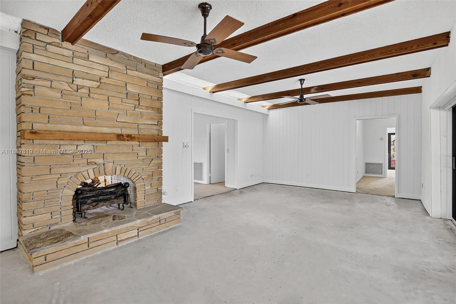 100 129th Avenue Plantation, FL 33325 - Photo 18 of 60 a view of an empty room with fireplace and a fan