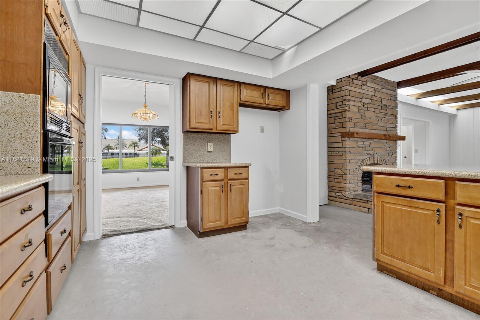 100 129th Avenue Plantation, FL 33325 - Photo 22 of 60 a kitchen with cabinets and a stove