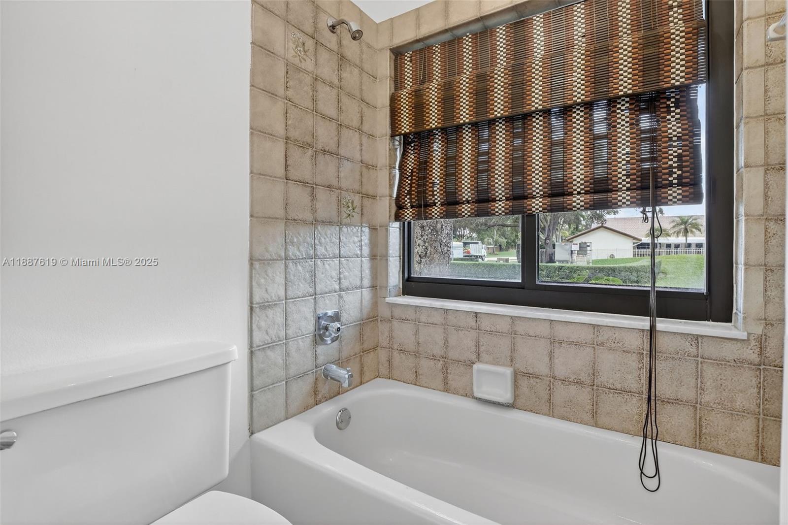 100 129th Avenue Plantation, FL 33325 - Photo 31 of 60 a bathroom with a bathtub and shower
