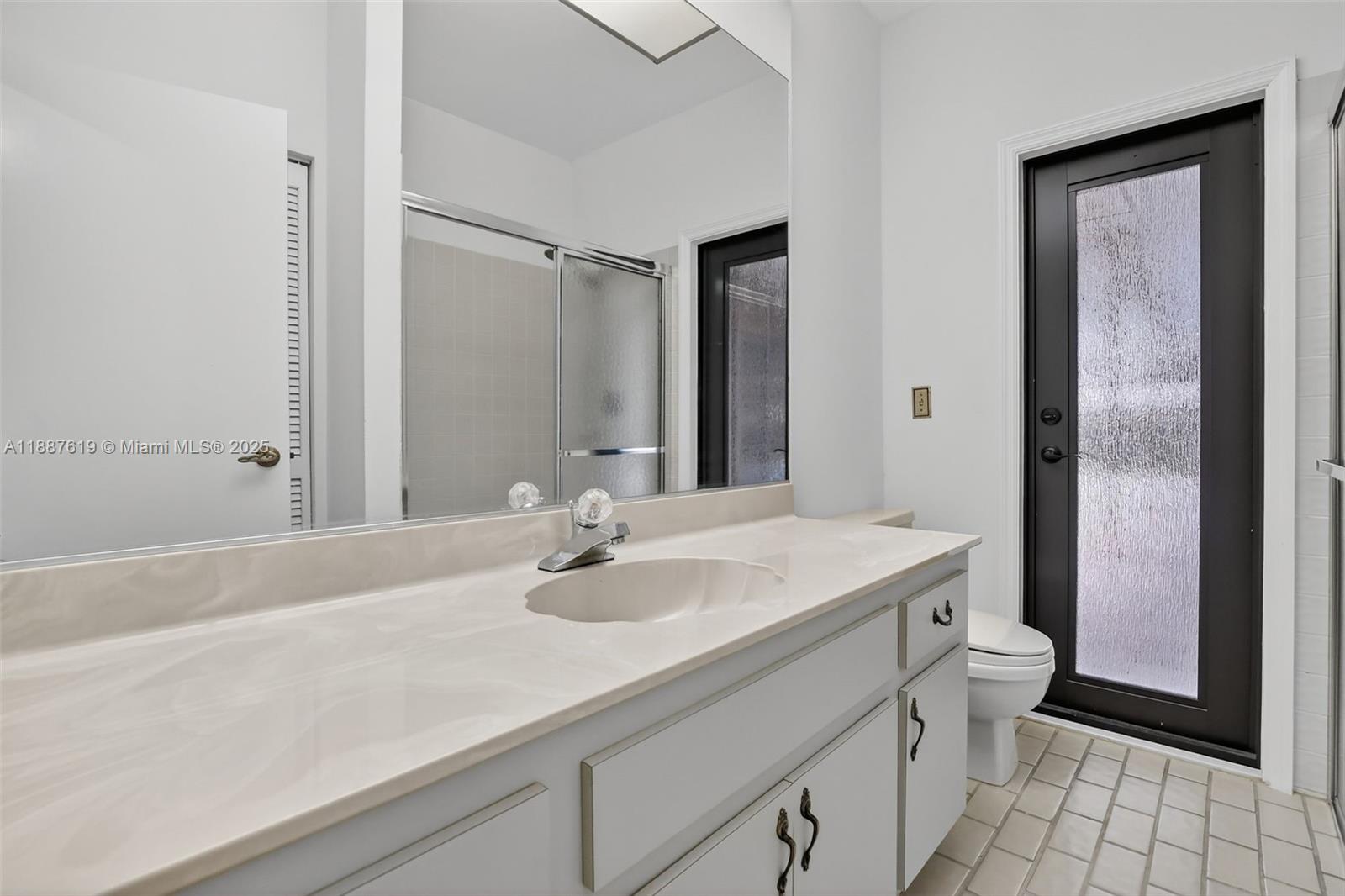 100 129th Avenue Plantation, FL 33325 - Photo 36 of 60 a bathroom with a sink and a mirror