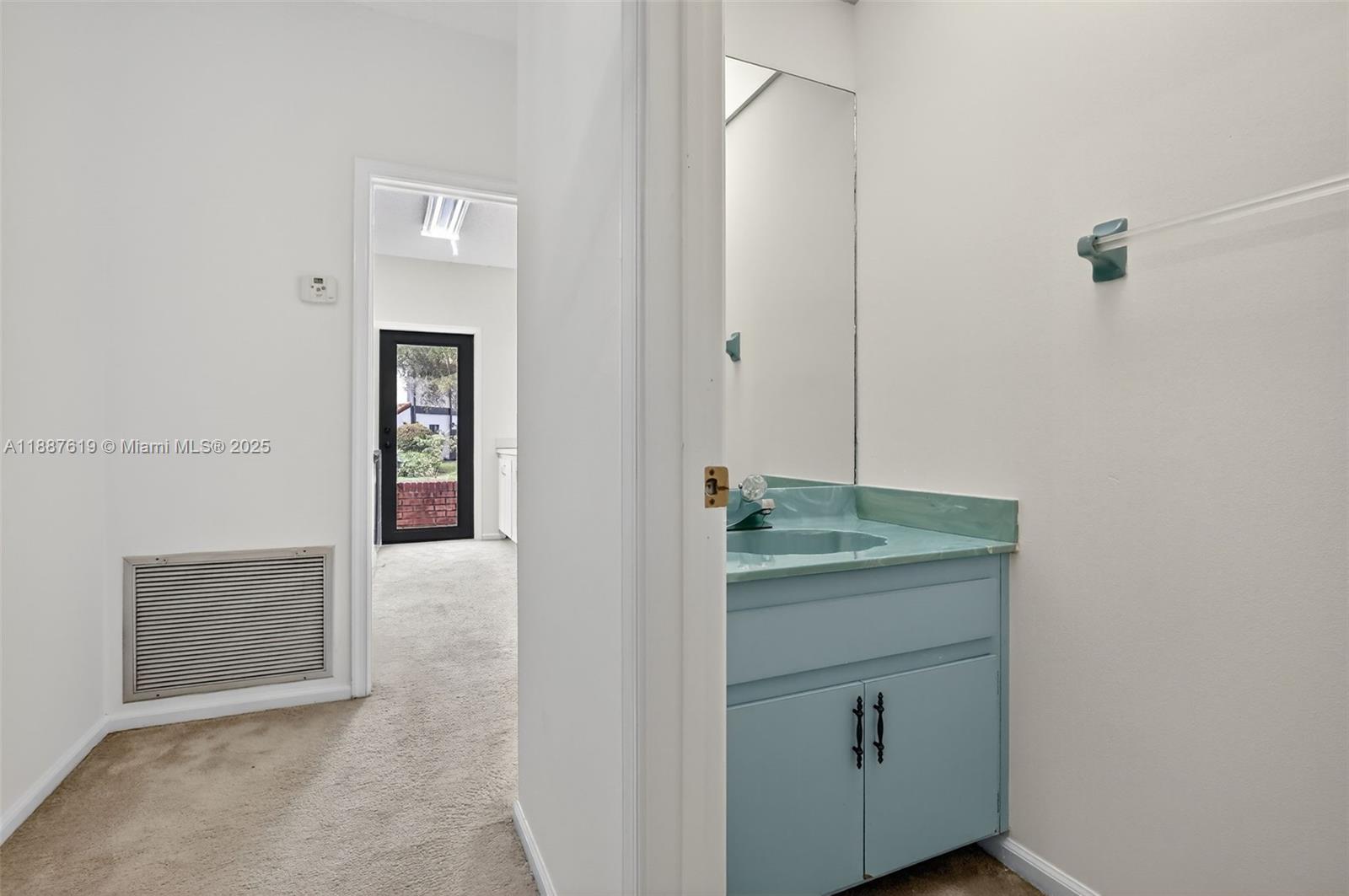 100 129th Avenue Plantation, FL 33325 - Photo 41 of 60 a bathroom with a granite countertop sink and a mirror