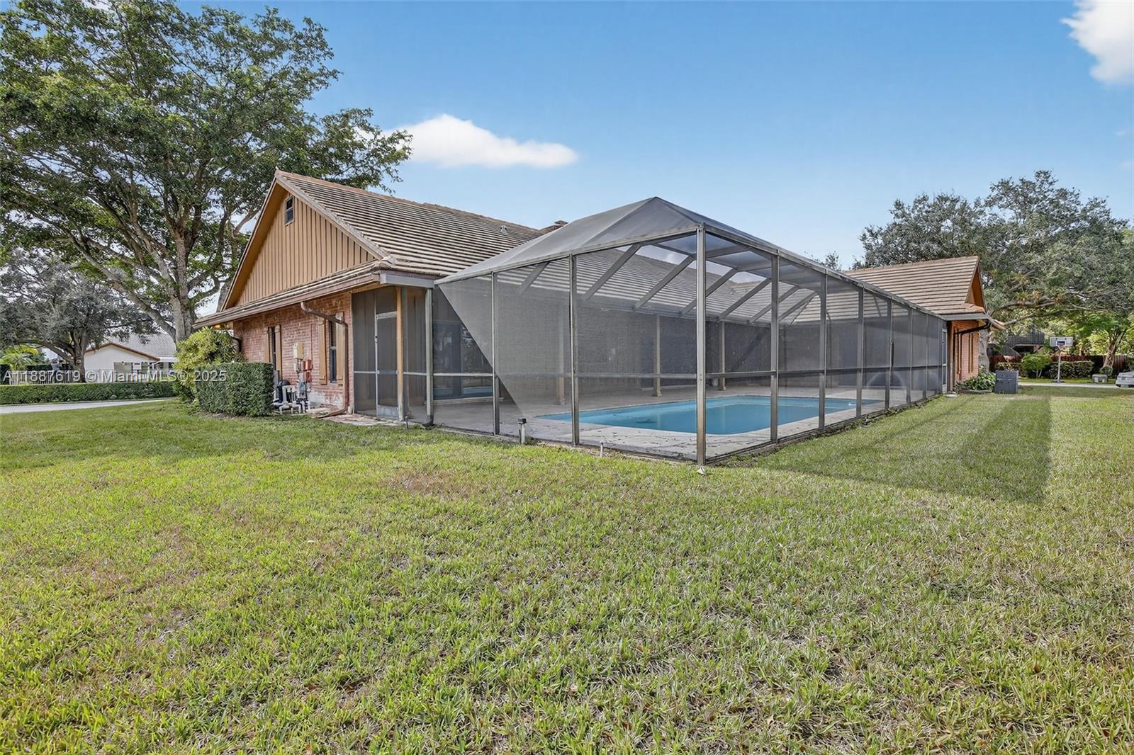 100 129th Avenue Plantation, FL 33325 - Photo 8 of 60 a house view with a garden space
