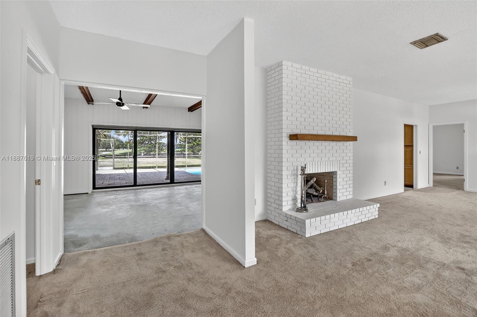 100 129th Avenue Plantation, FL 33325 - Photo 10 of 60 a view of a livingroom with a fireplace