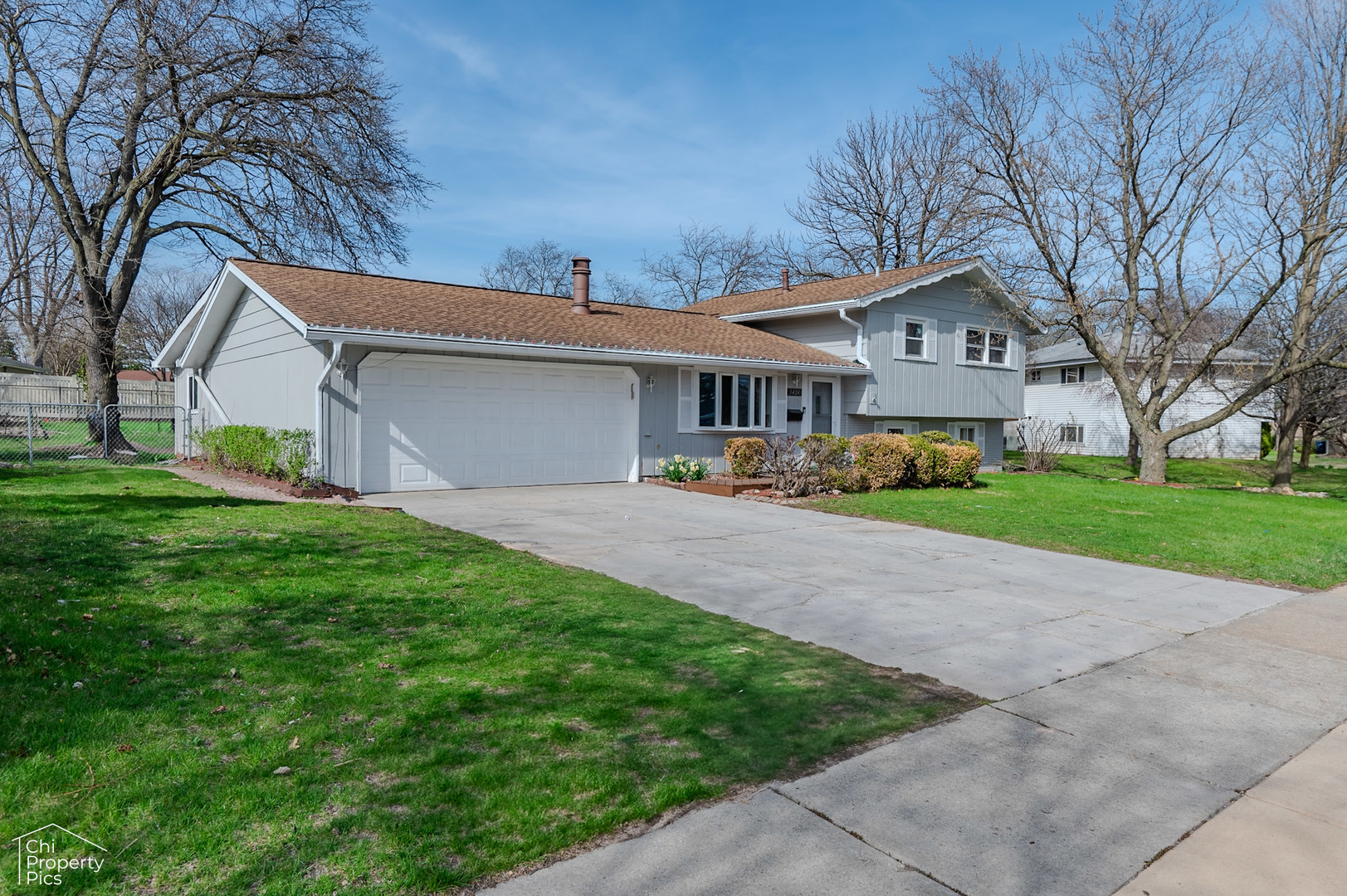 1424 West Wise Road Schaumburg, IL 60193 - Photo 2 of 2 a front view of house with yard and green space