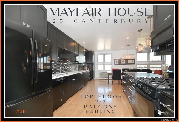 a open kitchen with stainless steel appliances granite countertop a stove and a refrigerator