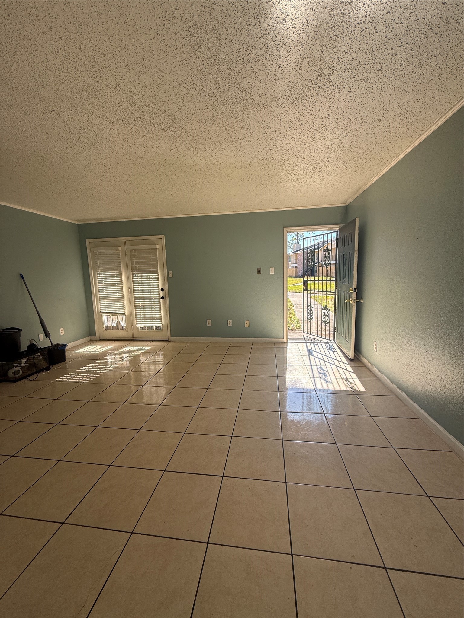 7402 Alabonson Road, Unit 407 Houston, TX 77088 - Photo 11 of 14 a view of an empty room and window