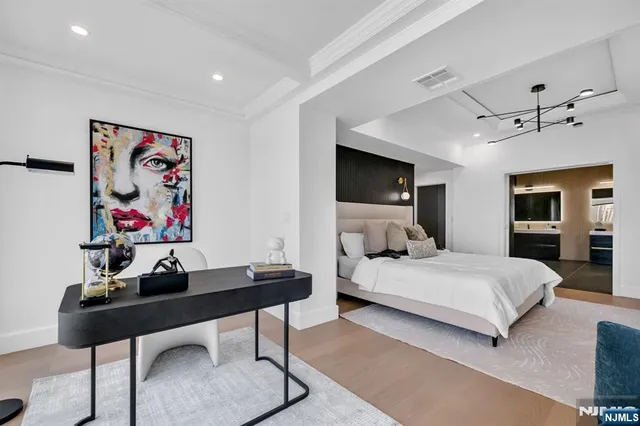 a bedroom with a bed and a table