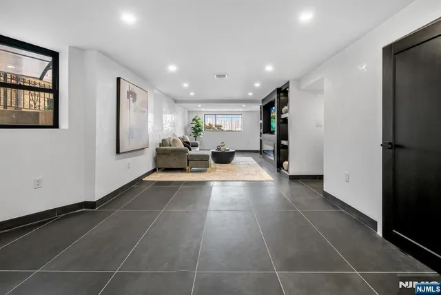 a lobby with furniture and a window
