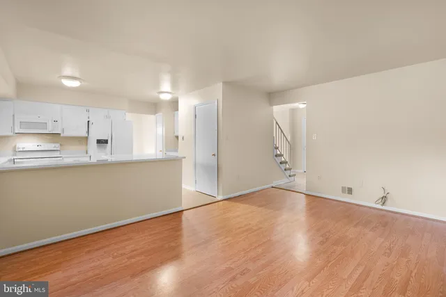 a view of kitchen with wooden floor