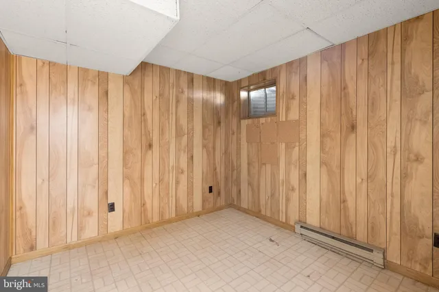 a view of an empty room and a window