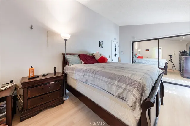 a bedroom with a bed and a dresser