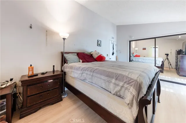 a bedroom with a bed and a dresser