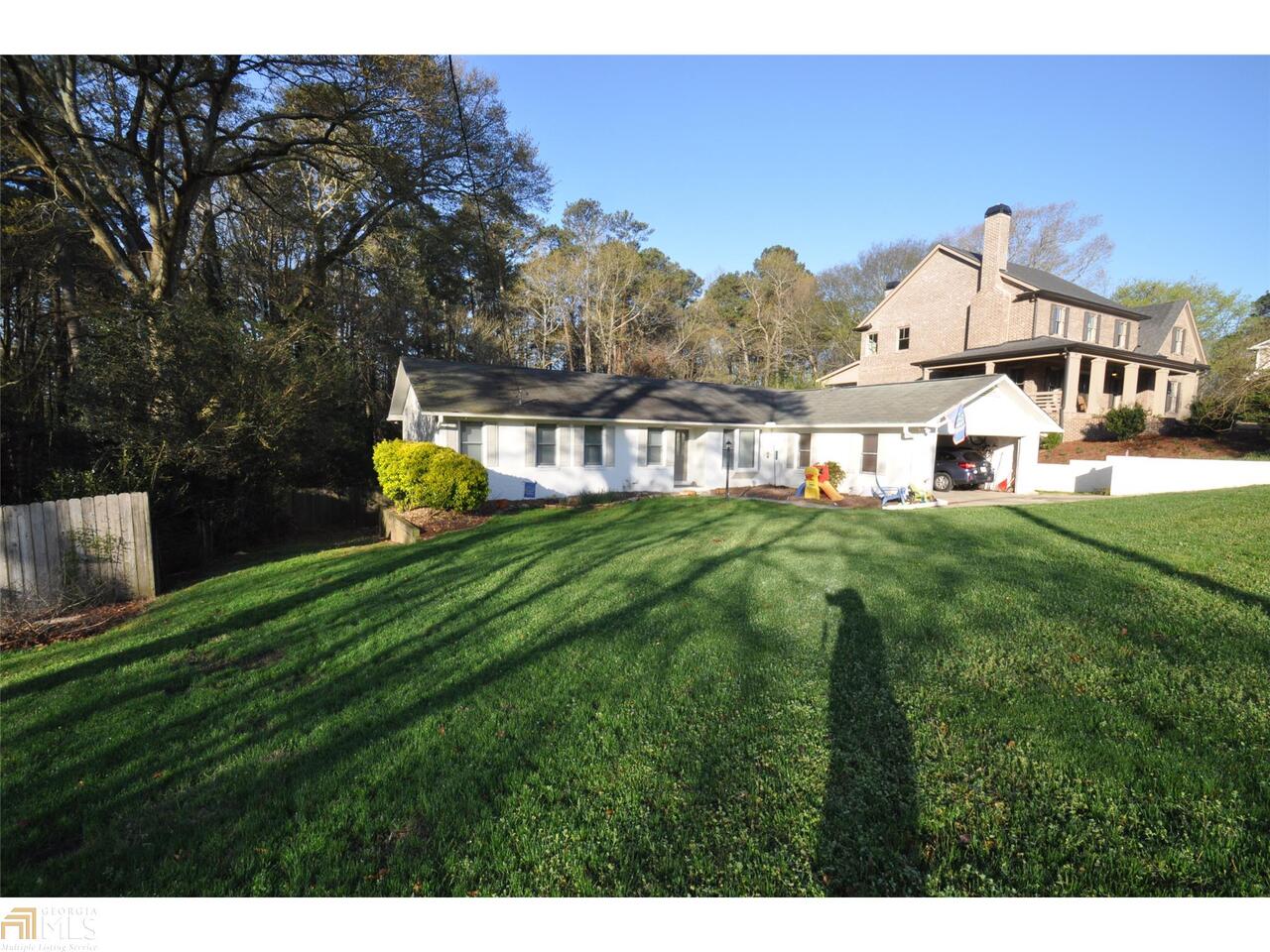 2758 Redding Road Northeast Brookhaven, GA 30319 - Photo 1 of 1 a view of a house with a big yard