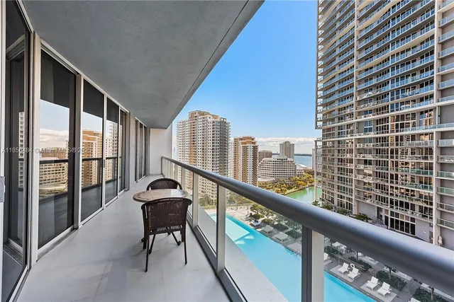 a view of a balcony with furniture