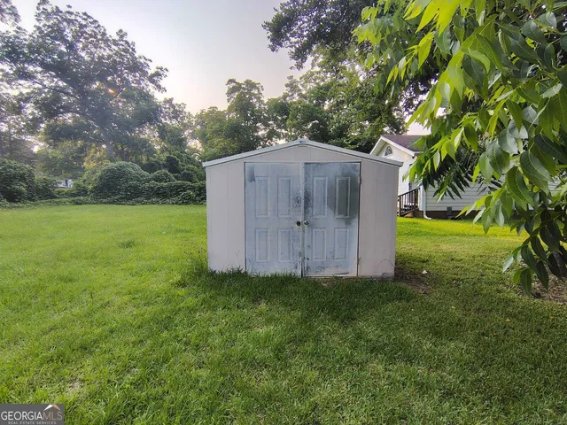a backyard of a house with lots of green space
