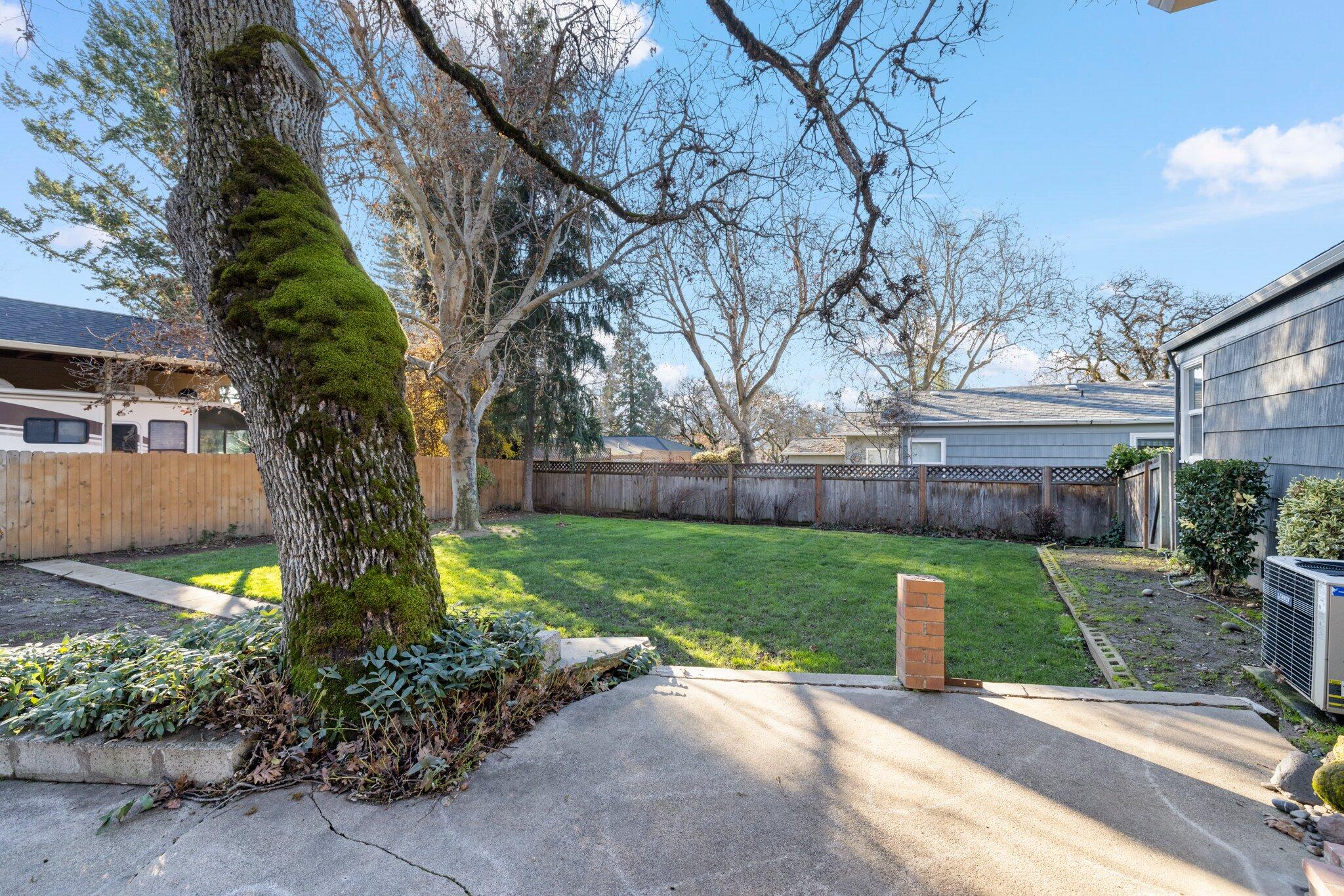 2418 Hillcrest Road Medford, OR 97504 - Photo 22 of 25 Super fenced backyard with mature landscaping.
