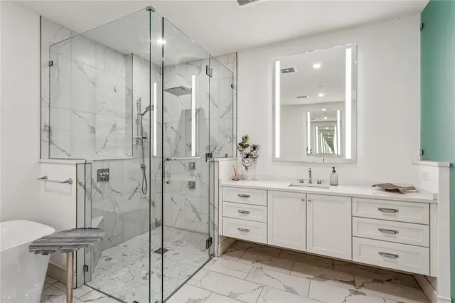 a bathroom with a sink a vanity and a mirror