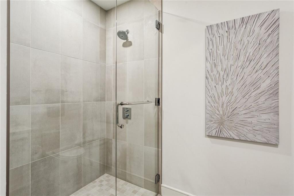 2520 Peachtree Road, Unit 602 Atlanta, GA 30305 - Photo 22 of 45 a bathroom with a shower and a sink