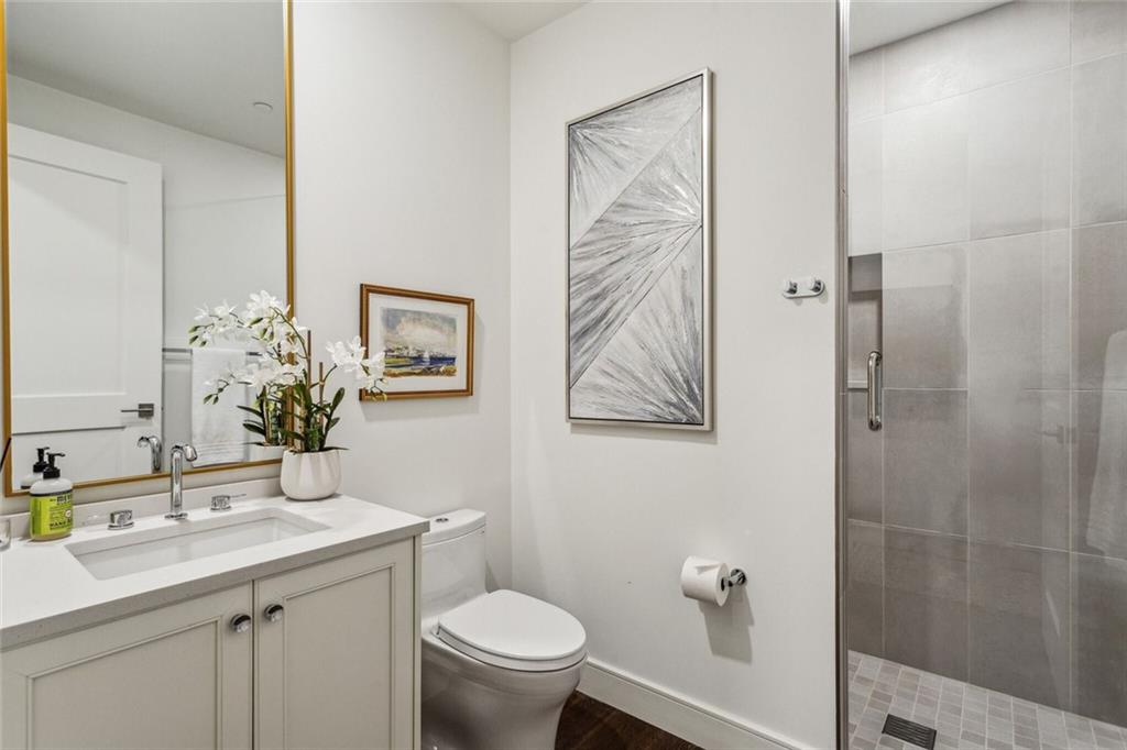 2520 Peachtree Road, Unit 602 Atlanta, GA 30305 - Photo 23 of 45 a bathroom with a toilet sink and mirror