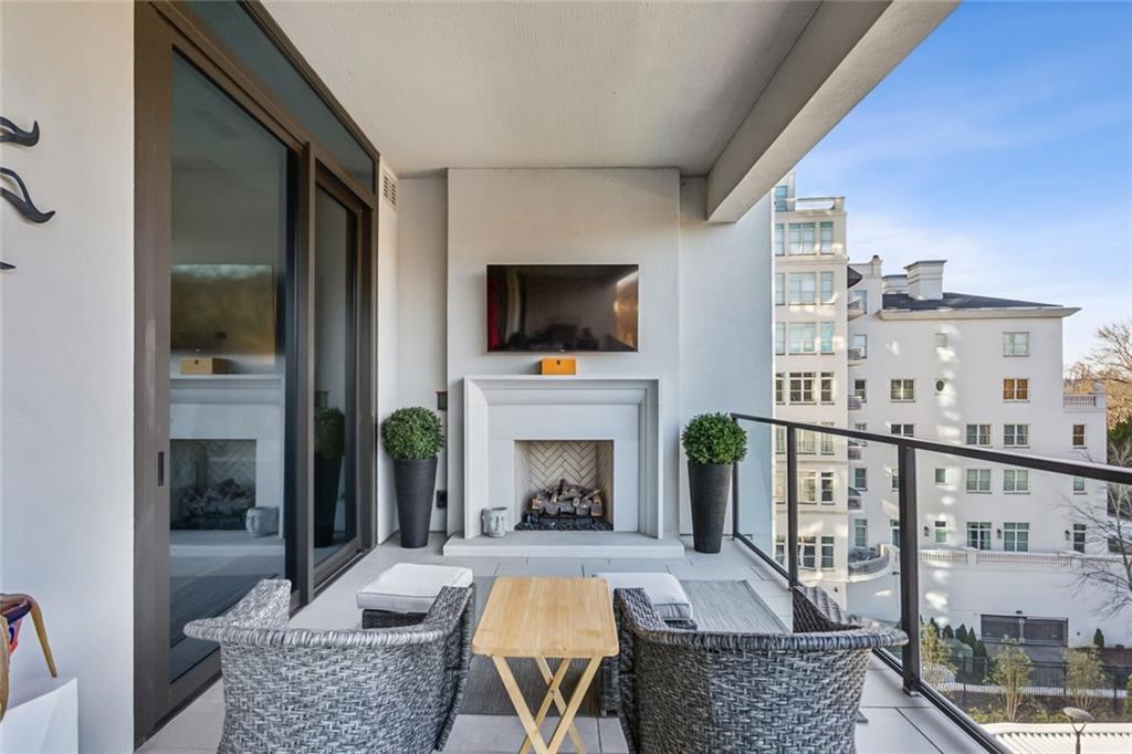 2520 Peachtree Road, Unit 602 Atlanta, GA 30305 - Photo 25 of 45 a living room with furniture a flat screen tv and a fireplace