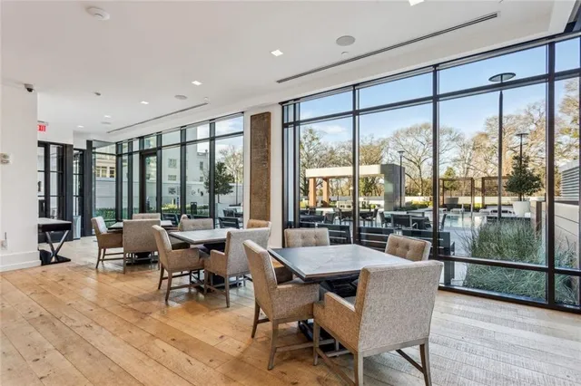 a living room with a flat screen tv and a table
