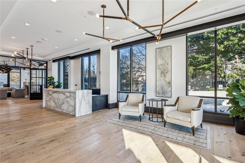 2520 Peachtree Road, Unit 602 Atlanta, GA 30305 - Photo 38 of 45 a living room with furniture and large windows