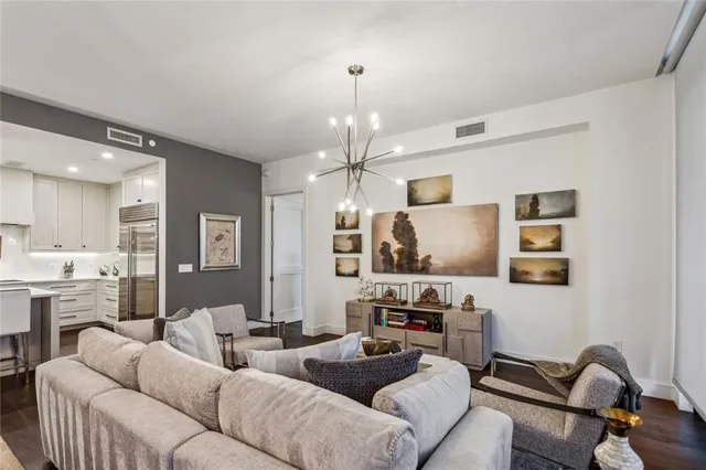a view of a dining room with furniture and a chandelier