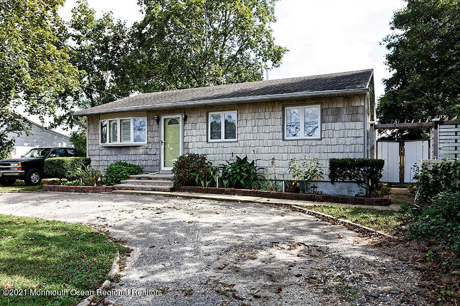 458 Dover Road Toms River, NJ 08757 - Photo 1 of 13 a front view of a house with garden
