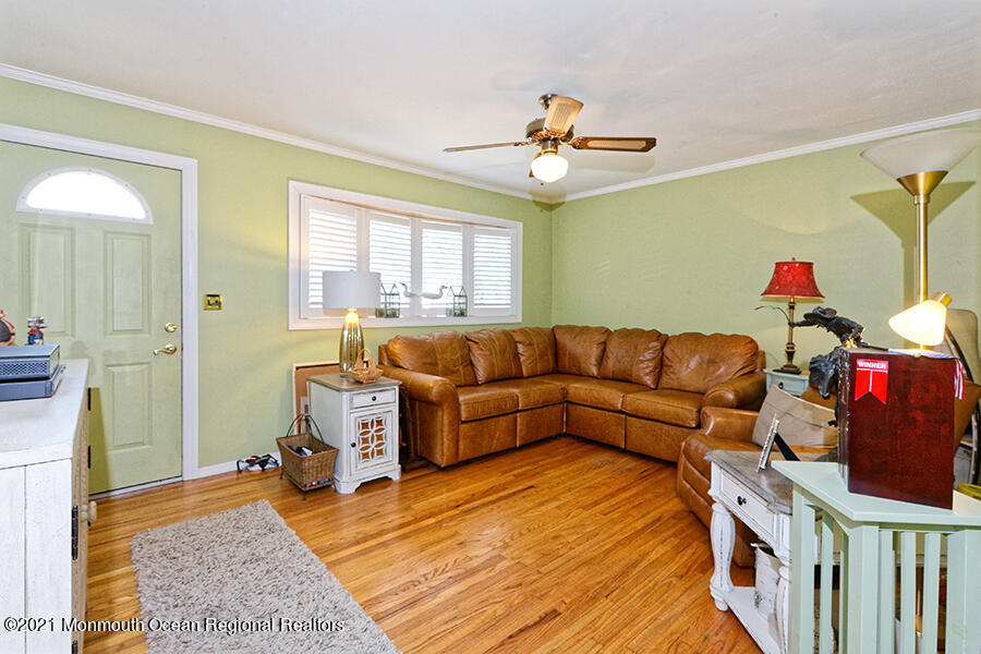 458 Dover Road Toms River, NJ 08757 - Photo 5 of 13 a living room with furniture and a chandelier